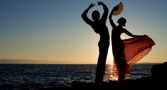 spanish dancers dancing by the sea in spain