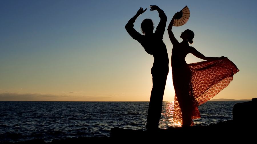 spanish dancers dancing by the sea in spain